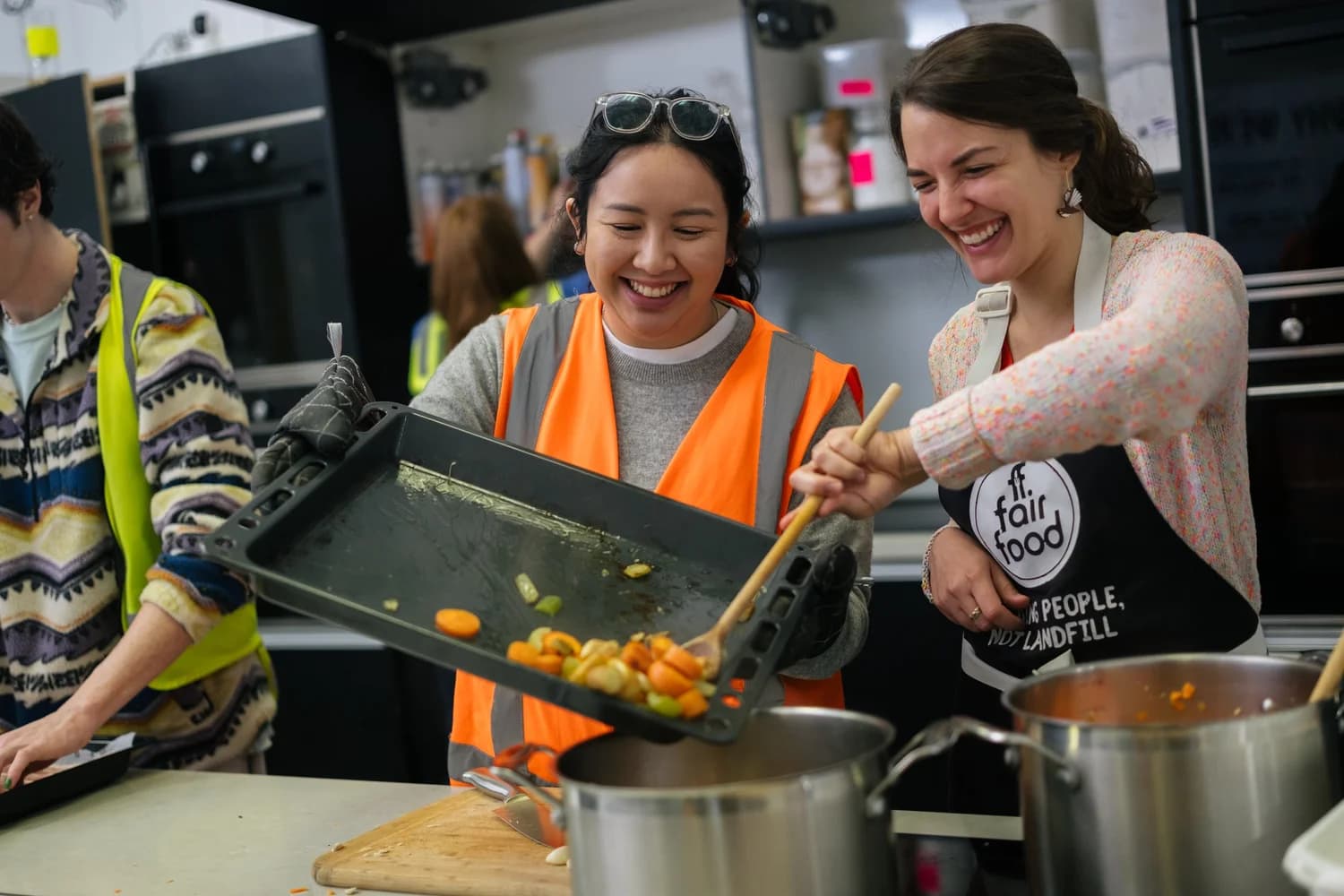 Cooks preparing a meal in the Conscious Kitchen